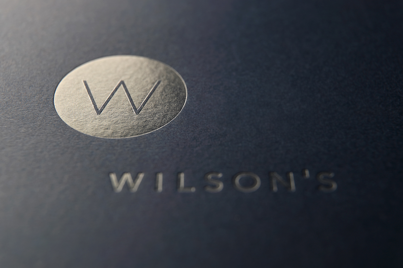 Wilson's Attorneys logo varnished onto blue folder. Design by MR.SMiTH Creative Studio.