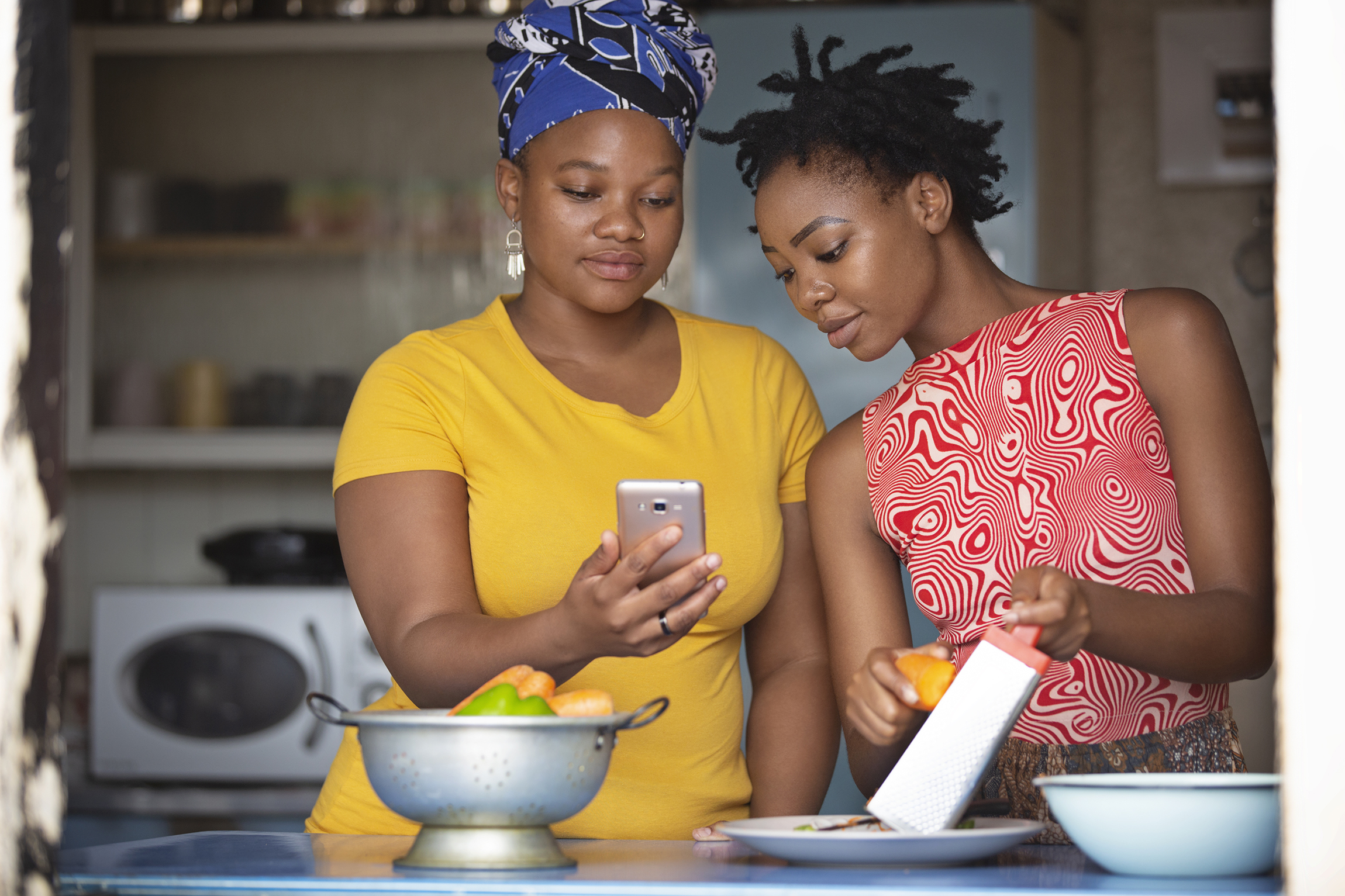 Two young ladies in South Africa cooking together